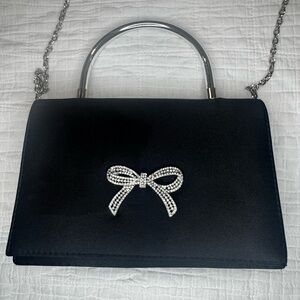 Elegant Black Handbag with Silver Bow Accent